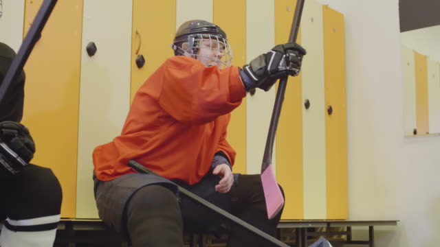 Female-Hockey-Team-Preparing-for-Hockey-Game