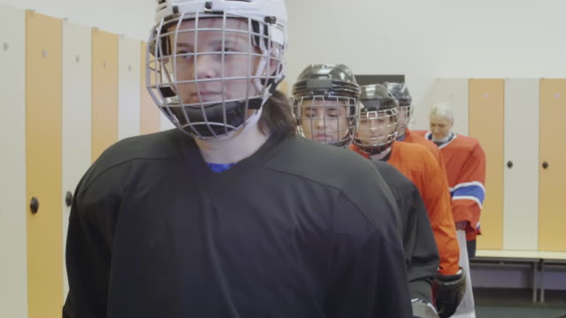 Female-Hockey-Team-in-Cloakroom