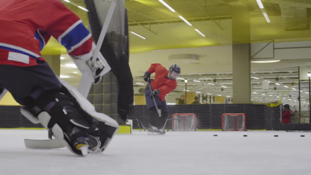 Female-Hockey-Forward-Having-Practice-on-Ice