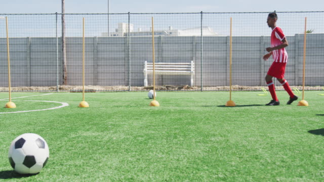 Soccer-players-training-on-field