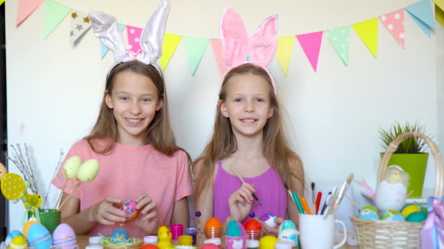 Happy-easter.-Beautiful-little-kids-wearing-bunny-ears-on-Easter-day.