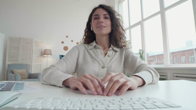 Woman-Communicating-with-Colleagues-from-Home