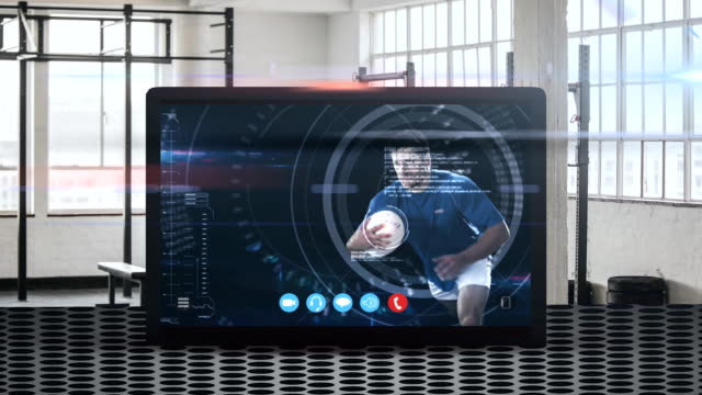 Animation-of-tablet-computer-showing-a-male-rugby-player-catching-a-ball.-Coronavirus--spreading.