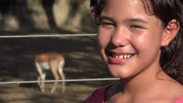 Girl-Posing-with-Deer-at-Zoo
