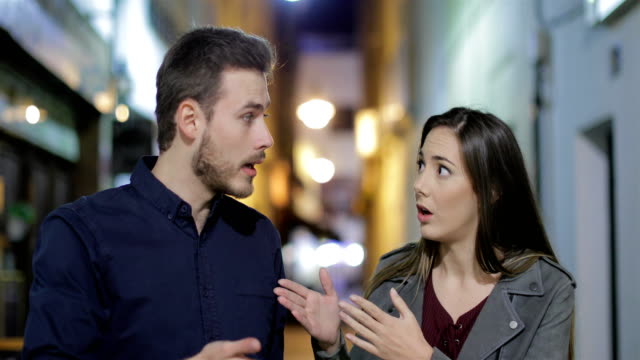 Couple-arguing-in-the-night-in-the-street