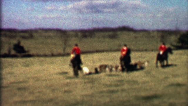 1958:-Horse-riding-fox-hunt-pack-dogs-follow-red-jacket-killers.