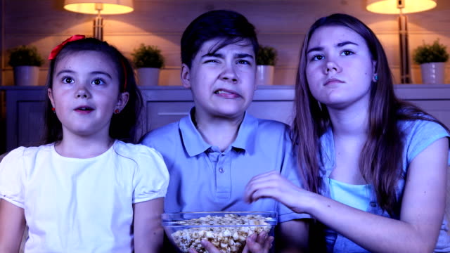 Children-watching-scary-movie-on-TV