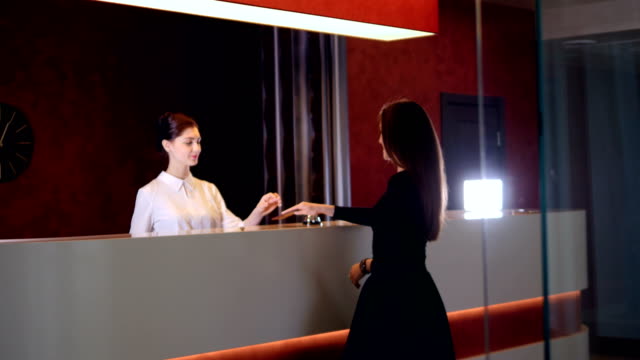 Hotel-service-manager-greeting-new-customer-businesswoman.-4K.
