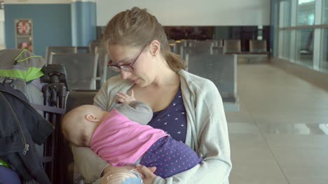 A-Woman-Breastfeeding-her-Child-at-the-Airport