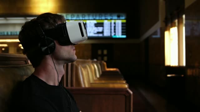 Young-tourist-man-using-VR-headset-Virtual-Reality-Glasses-for-travel-entertainment