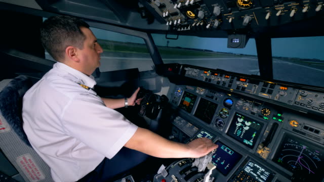 A-pilot-controls-a-plane-on-a-runway.
