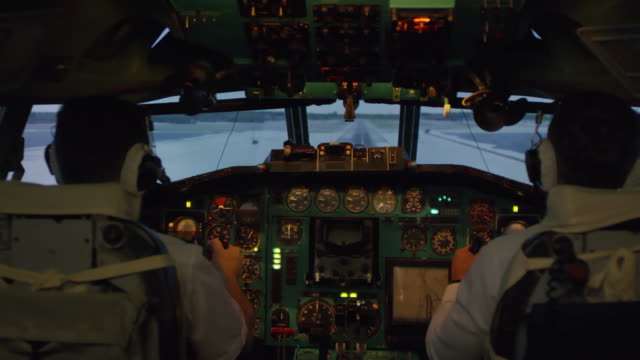 Pilots-in-Cockpit-Landing-Plane