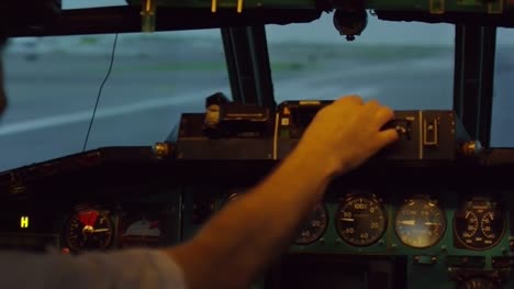 Pilot-Checking-Flight-Instruments-in-Cockpit