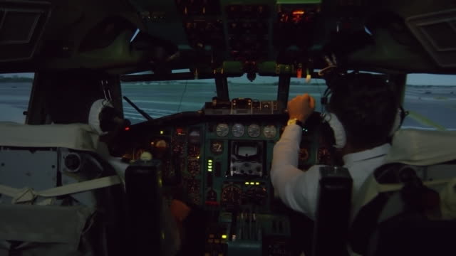 Pilots-Controlling-Airplane-Moving-along-Runway