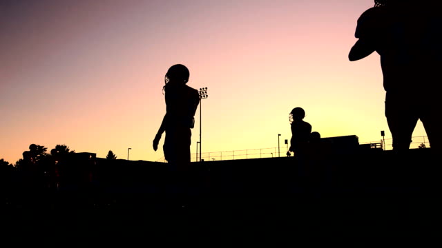 Silhouetted-Football-Players