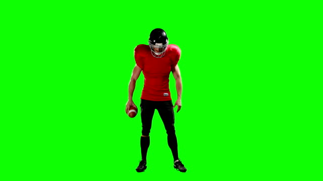 American-football-player-holding-ball