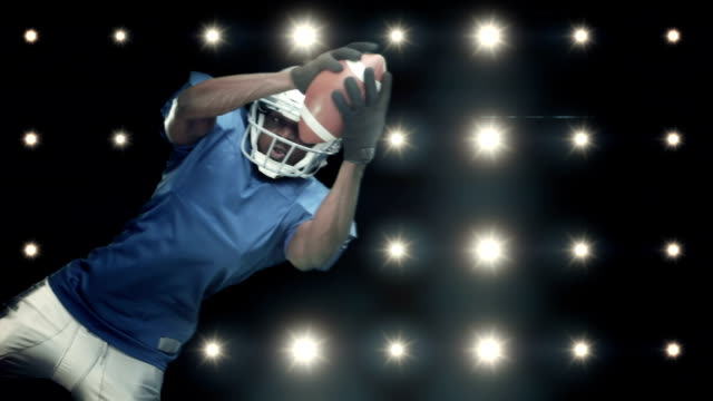 American-football-player-against-flashing-lights