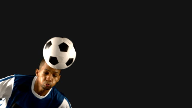 Football-player-heading-the-ball