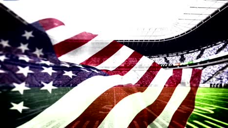 Bandera-estadounidense-soplando-en-estadio-de-fútbol-americano