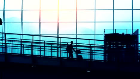 Sunset-Silhouettes-of-Commuter-in-Airport.