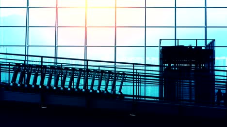 Sunset-Silhouettes-of-Commuter-in-Airport.
