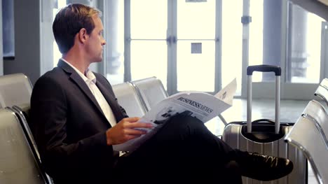 Businessman-reading-a-newspaper