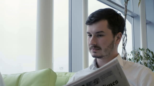 Businessman-reading-newspaper