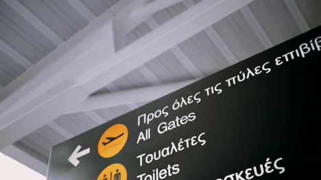 Airport-information-board-in-English-and-Greek