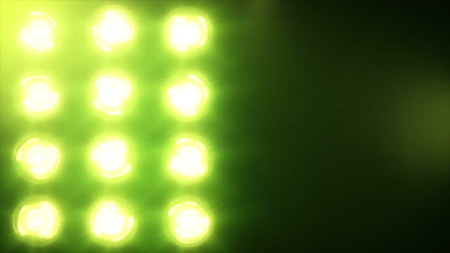 Stage-lights,-with-sound.-Green.-Close-up.