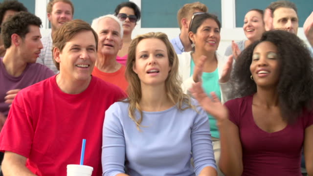 Spectators-Clapping-At-Outdoor-Sports-Event-In-Slow-Motion