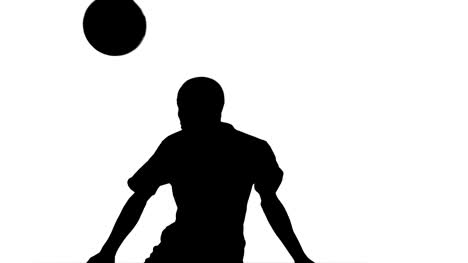Silhouette-of-football-player-heading-the-ball