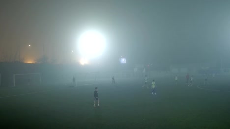 Young-football-team-play-game-on-foggy-day.-Belgrade,-Serbia