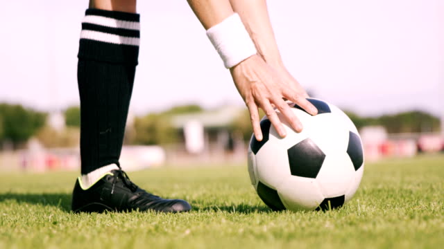 Football-player-kicking-the-ball
