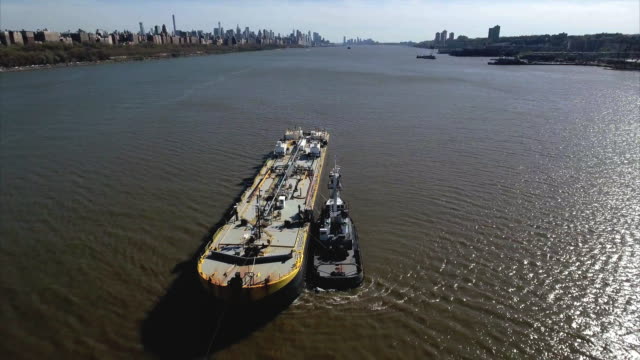 Fly-Backwards-Over-Oil-Tanker-Next-To-Tug-Boat-on-Hudson-River