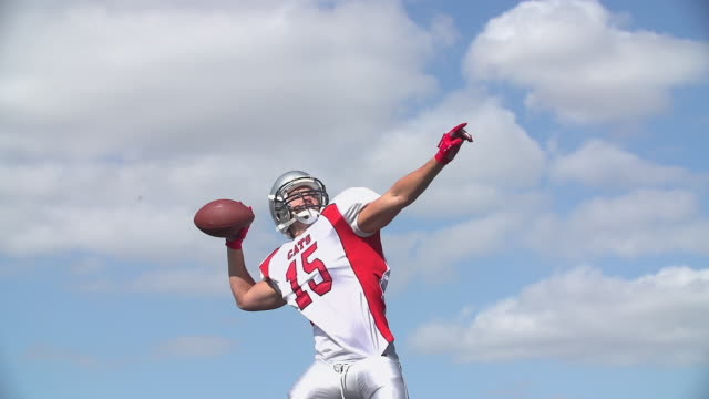 An-American-Football-Quarterback-throws-the-ball-and-celebrates.
