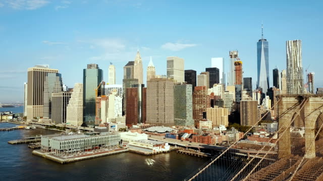 Aerial-view-of-the-capital-of-America.-Brooklyn-bridge-through-the-East-river-to-Manhattan-in-New-York