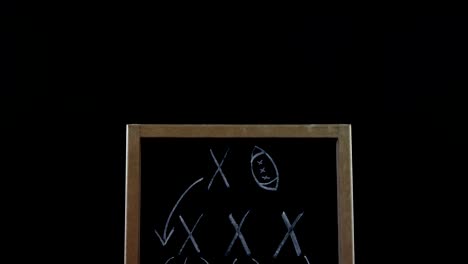 Close-up-of-American-football-and-game-strategy-drawn-on-board-4k