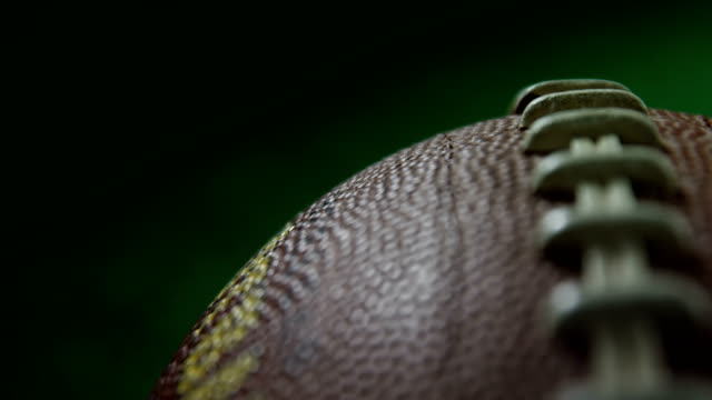 Stitches-on-American-football-4k