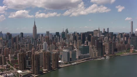 Aerial-shot-of-downtown-Manhattan-buildings-from-East-River.
