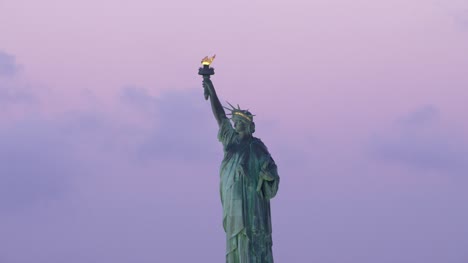Low-angle-aerial-view-of-Statue-of-Liberty-at-sunrise.