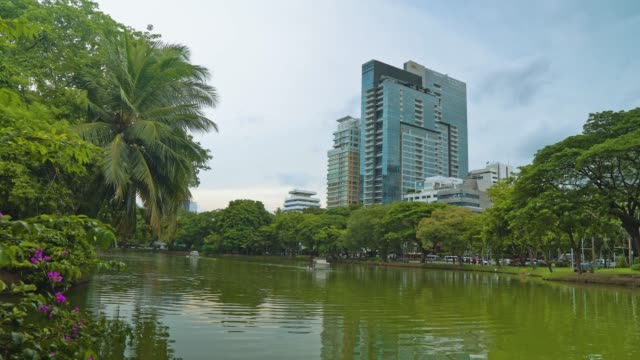 corporate-buildings-overlooking-the-green-park-with-a-lake.-business-district