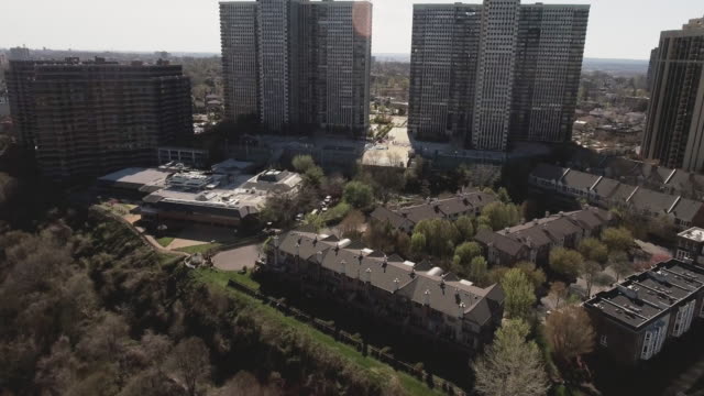 Cliffside-Park-NJ-Flyover-Trees-Towards-Apartment-Complexes