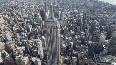 NYC-Aerial-Top-to-Front-Shot-Of-Empire-State-Viewing-Downtown