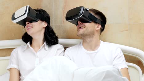 Couple-using-VR-glasses.