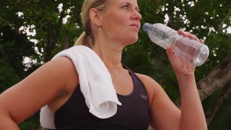 Woman-drinking-water-after-run.