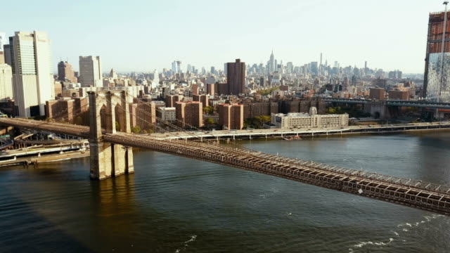 Aerial-view-of-the-Brooklyn-bridge,-Manhattan-district-in-New-York,-America.-Drone-flying-over-the-East-river