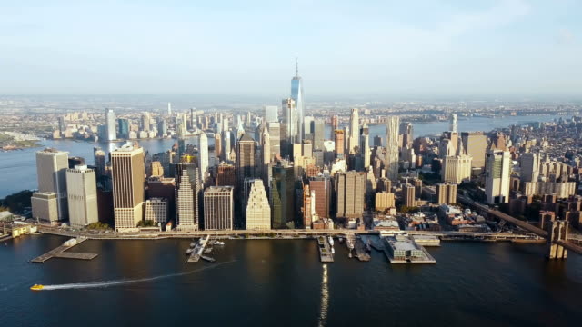Aerial-view-of-New-York,-America.-Drone-flying-over-the-East-river-and-Manhattan-downtown-on-the-shore