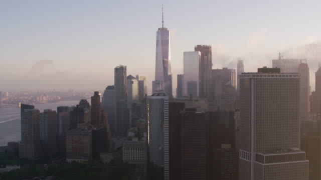 Tracking-by-lower-Manhattan-buildings-with-low-clouds-and-early-morning-sunshine.