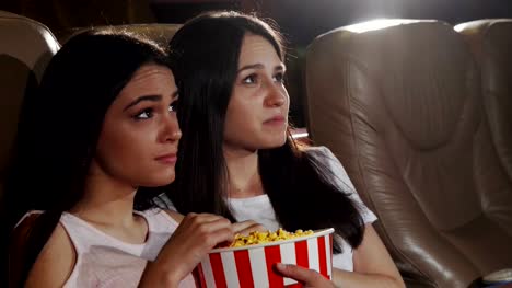 Female-friends-watching-dramatic-movie-together