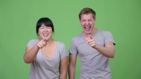 Young-multi-ethnic-couple-laughing-together